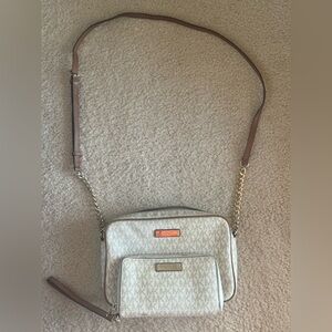 Michale Kors crossbody purse and matching wallet.